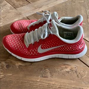 Men’s red Nike free running shoe